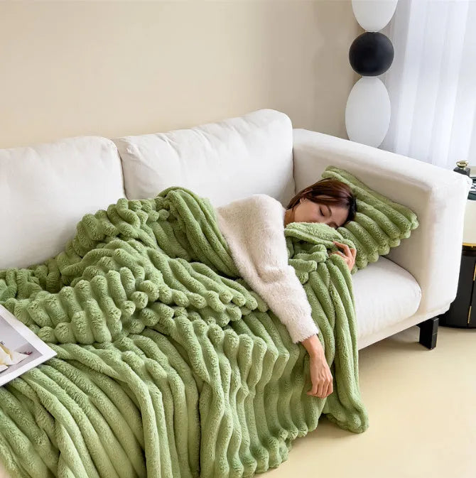Soft Wind double-sided thickening bubble velvet blanket in a solid colour shown on a sofa.