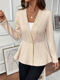 Women's apricot coloured knitted cardigan with jacquard pattern and one button, shown on a model.