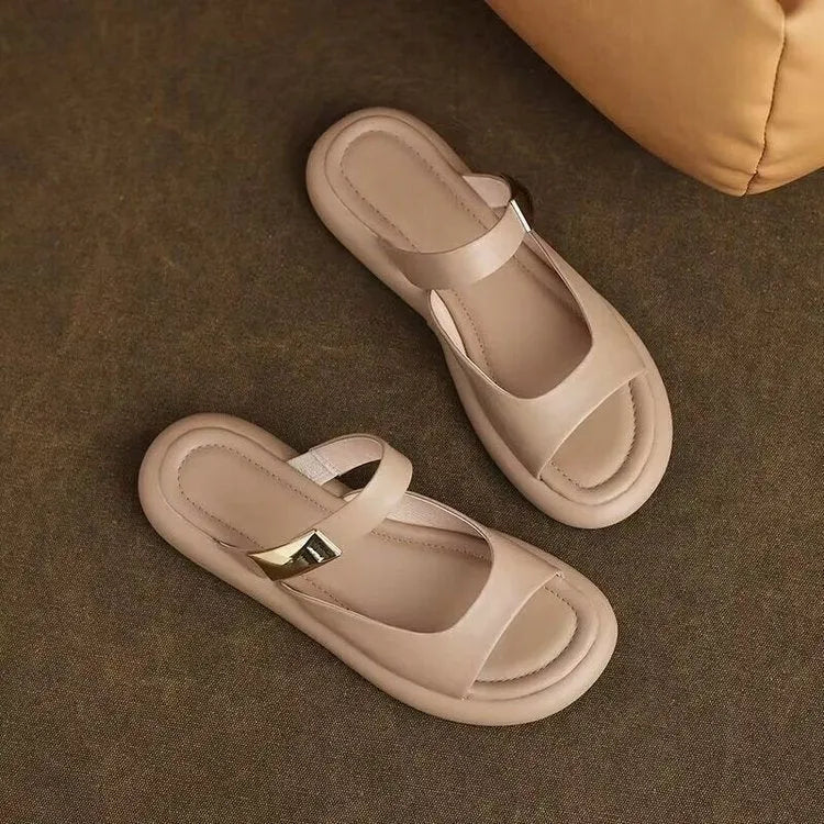 Women's apricot soft leather peep toe flat platform sandals with rubber sole on a white background.
