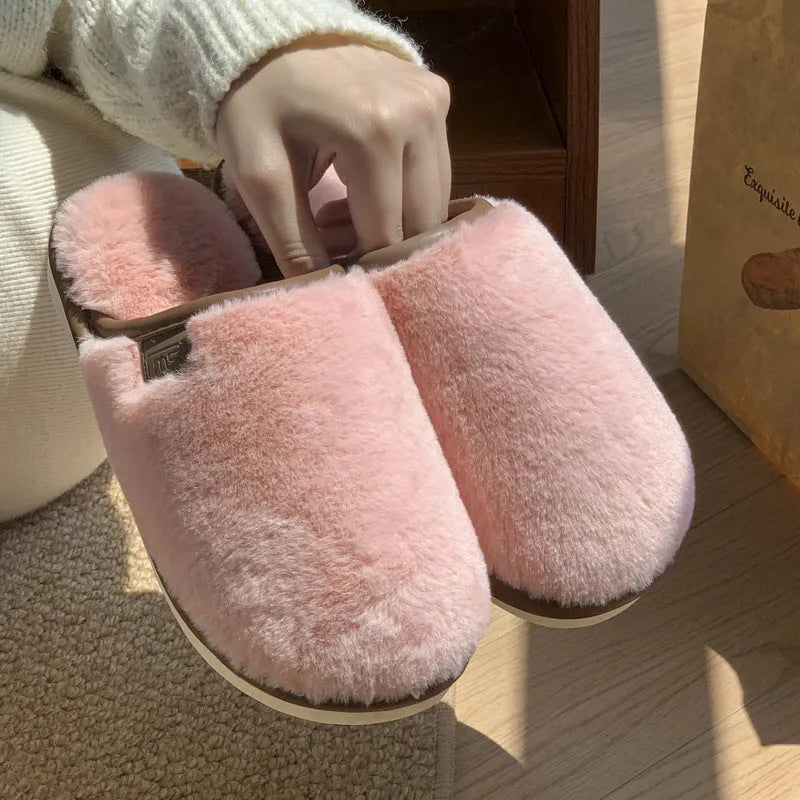 PVC non-slip winter slipper in a solid colour on a wooden floor.