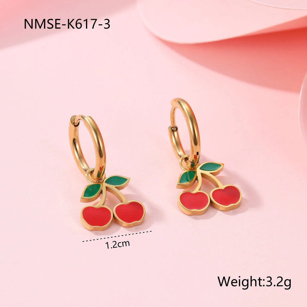 Cherry jewellery set showing necklace, bracelet, earrings, and ring with stainless steel construction and cherry fruit design