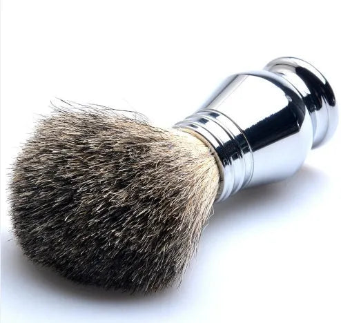 CSB men's shaving kit with chrome razor and stand, badger hair brush, soap bowl, and blades on black box.
