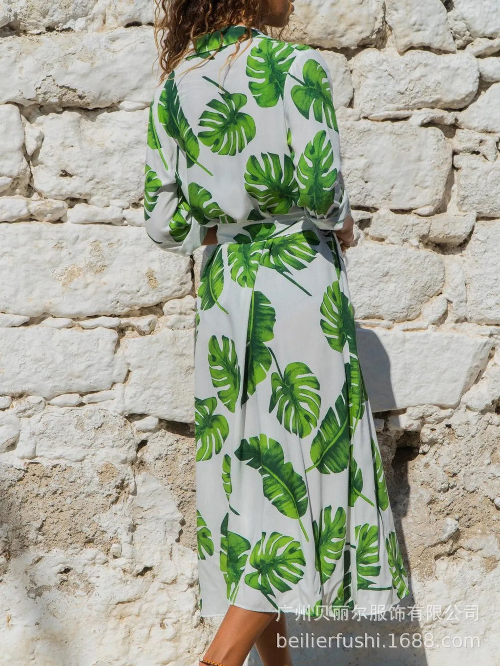 V-neck chiffon dress with high waist and printed pattern, shown in black colour.
