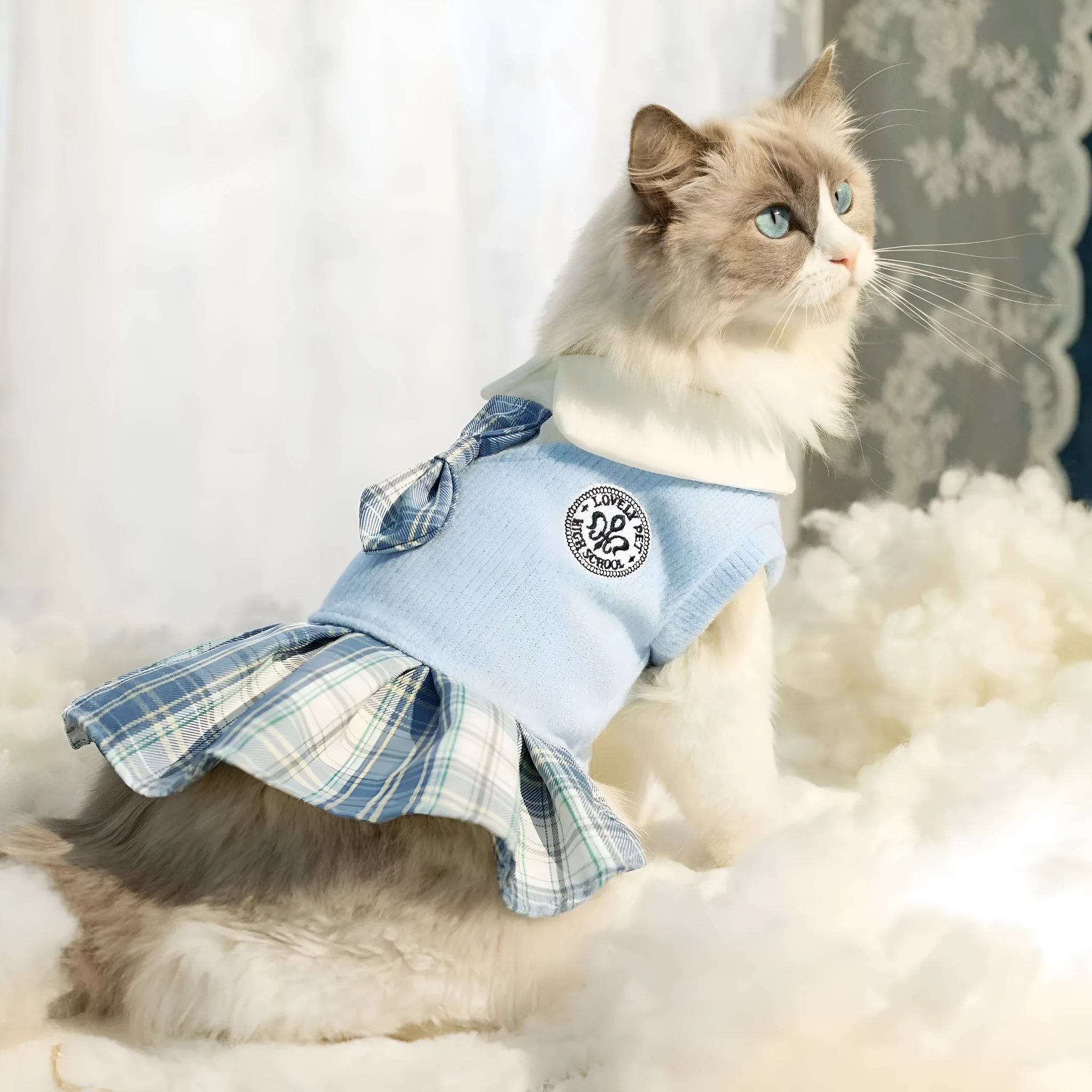 A tartan skirt for small pets in pink, blue, or green, made from polyester fabric.
