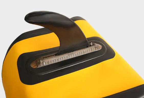 SUP paddle with large removable fish fins showing screw attachment mechanism
