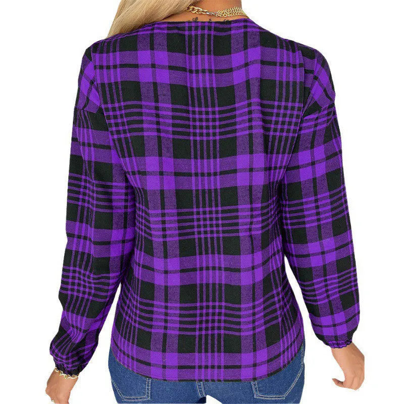 Women's purple, grey, and red plaid casual shirt with regular sleeves on a hanger.