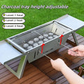 Small portable charcoal grill shown in a folded position for compact storage.