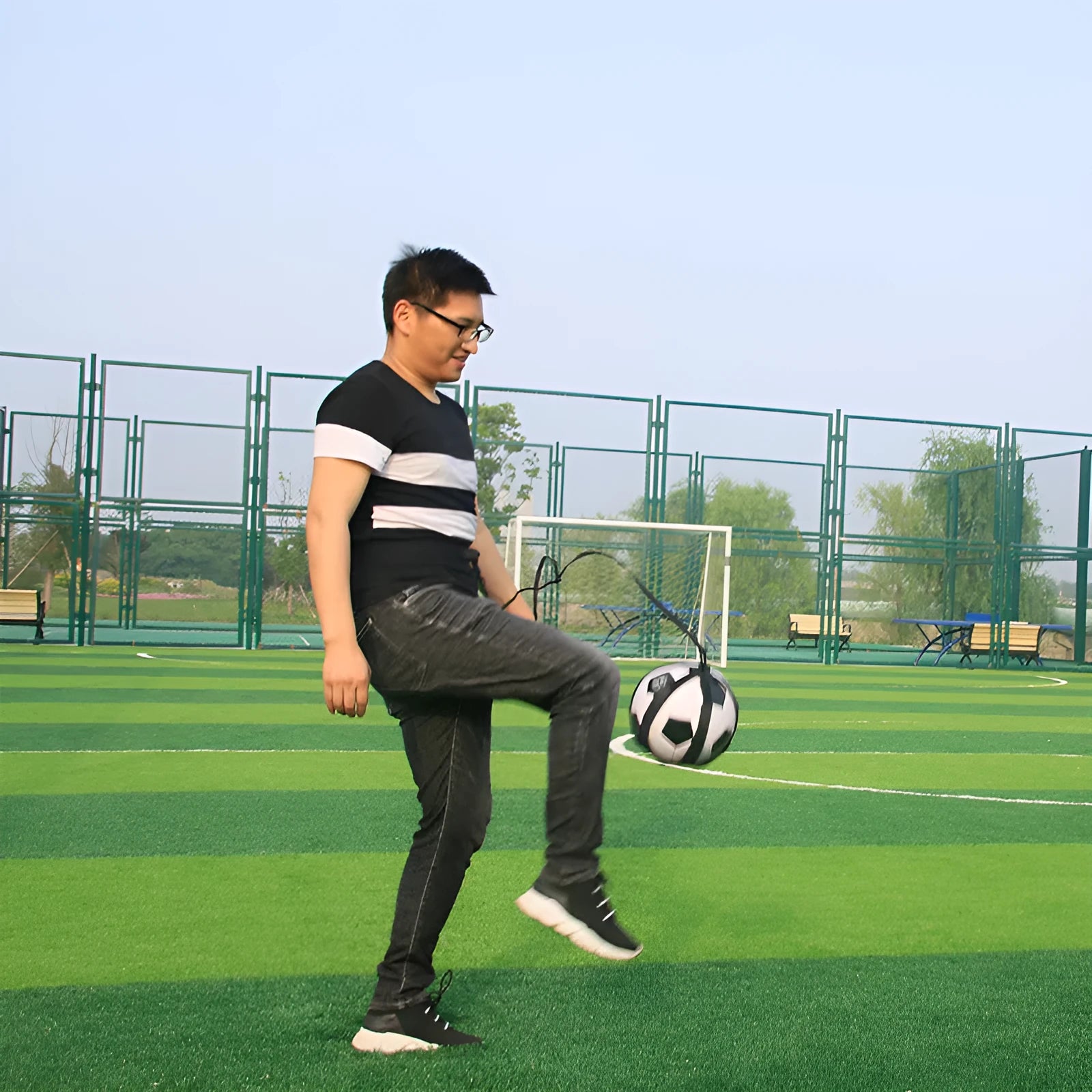Black football juggling belt with a 2-metre tether for solo training and fitness exercises.