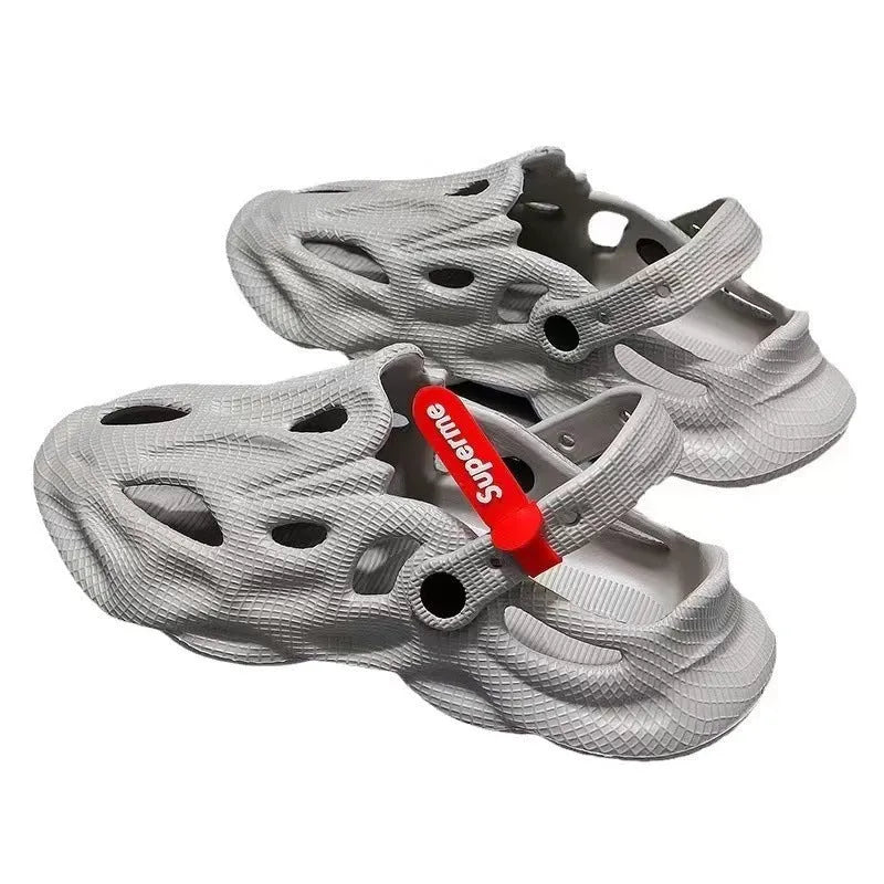 Men's grey EVA slippers with closed toe and breathable hole design on foot
