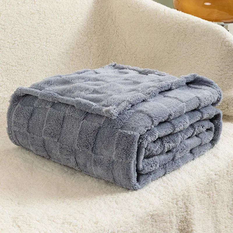 Geometric patterned polyester blanket in milky white showing cotton velvet texture and thickened construction