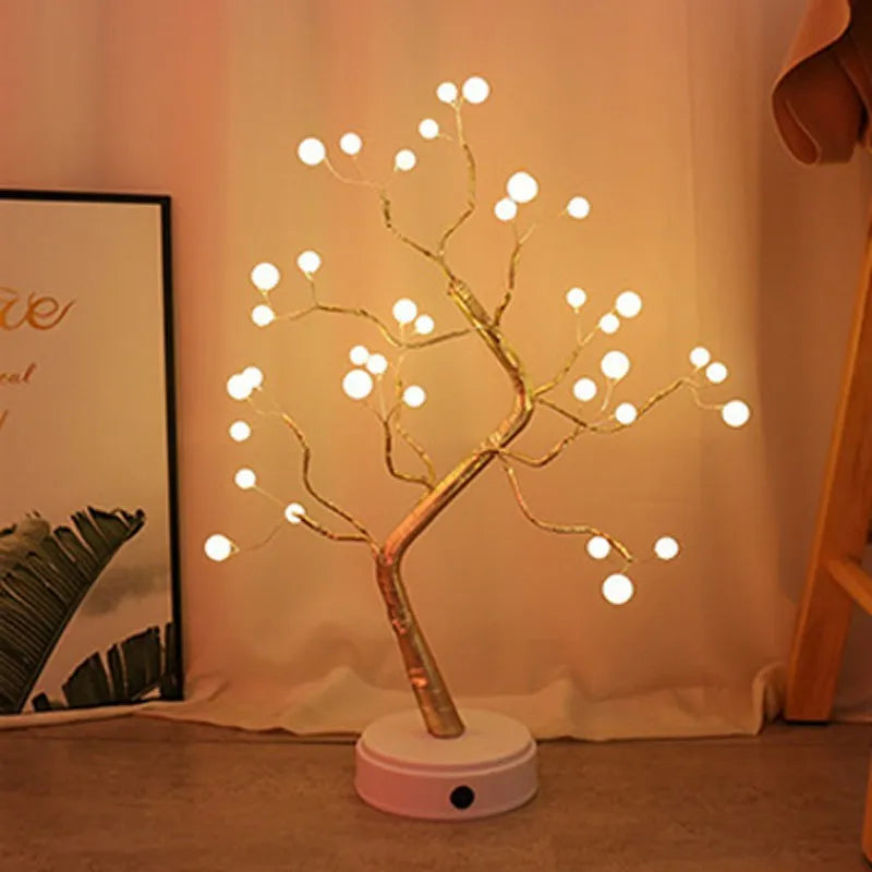 White LED Christmas tree shaped night light with touch base, standing 50cm tall on a table.