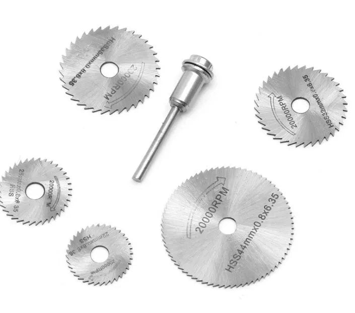 Set of six small high-speed steel circular saw blades and a mandrel for woodworking