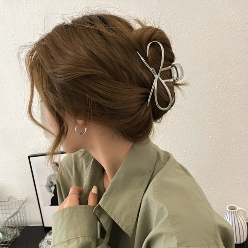 Korean style bow barrette with alloy metal construction in silver colour