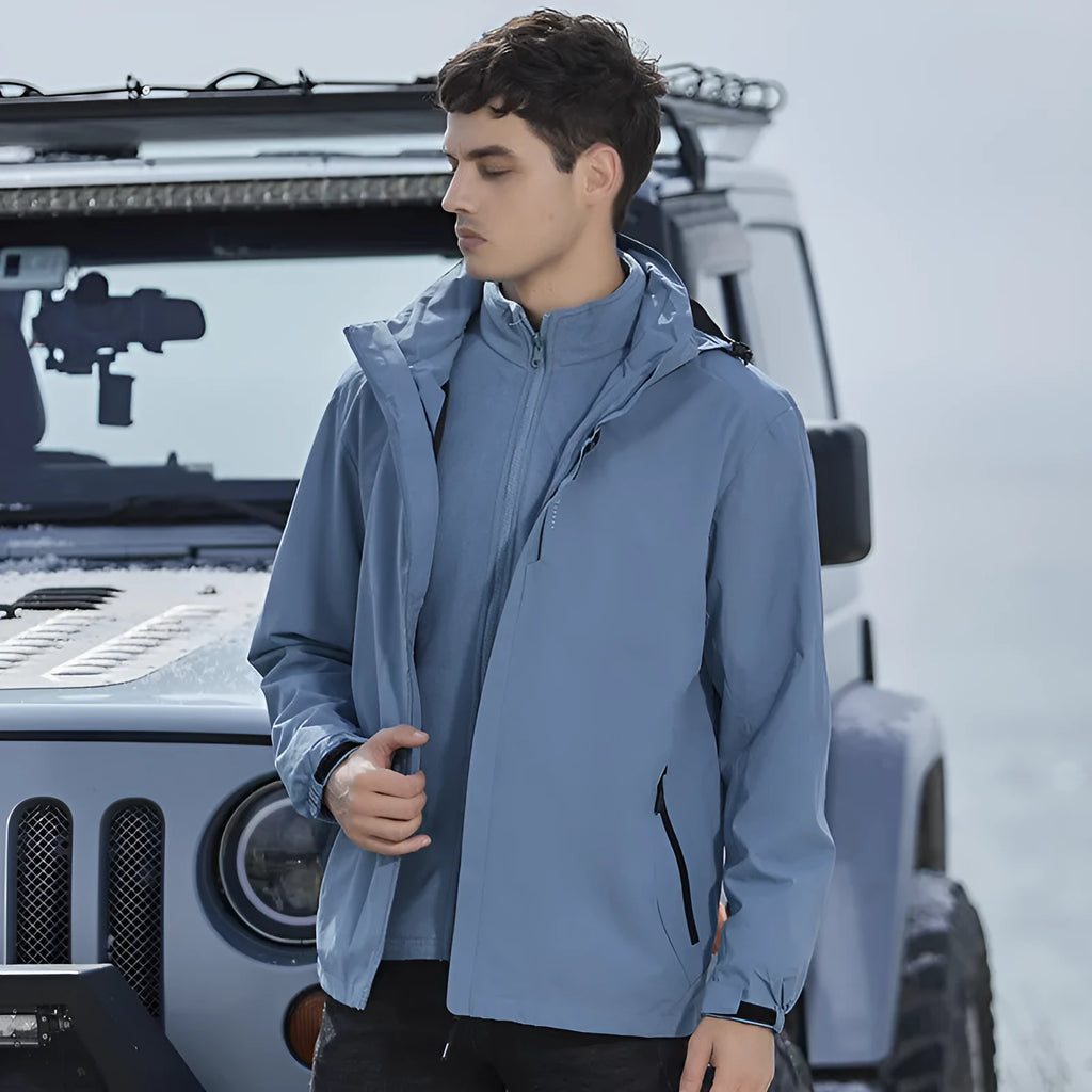 Men's black waterproof mountaineering jacket and trousers set with removable fleece lining.