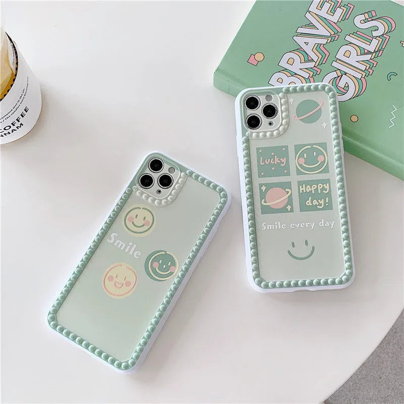 Green iPhone case with geometric shapes and smiley face pattern, TPU back cover.