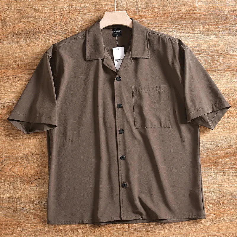 Men's loose-fit lightweight short sleeve shirt in solid colour, shown in Army Green.