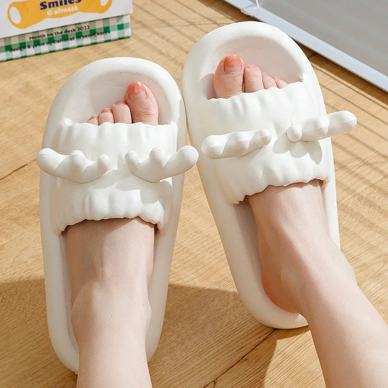Women's deer horn design flip flop slippers in light yellow EVA material with hollow-out pattern.