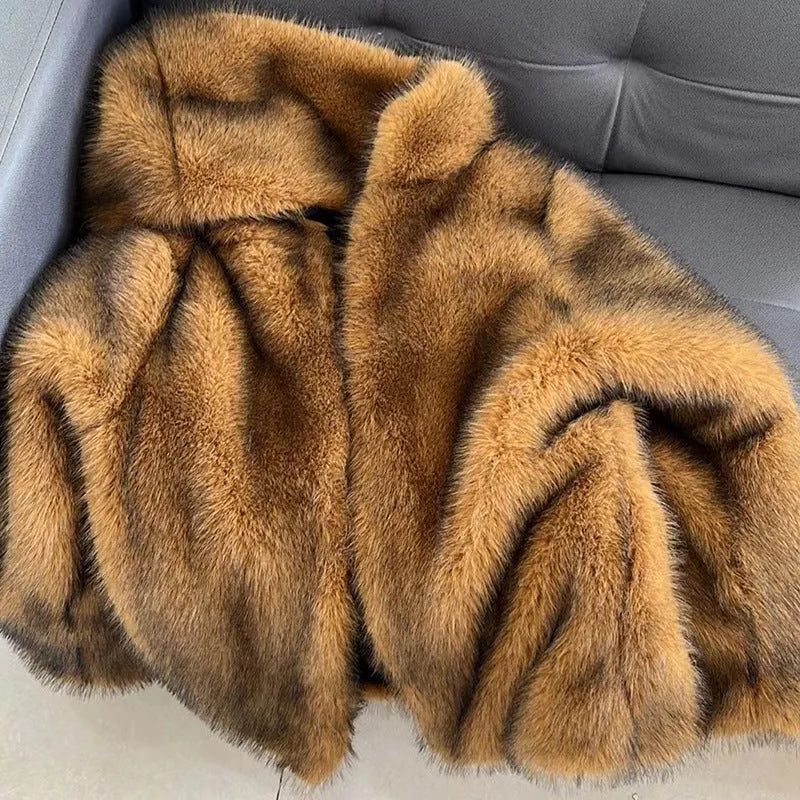 Silver grey loose-fit artificial fur mid-length coat for women on a hanger.