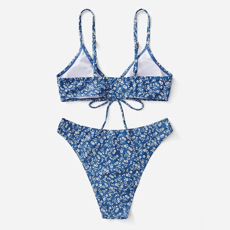 Blue three-piece polyester swimsuit set with top and shorts on a mannequin.