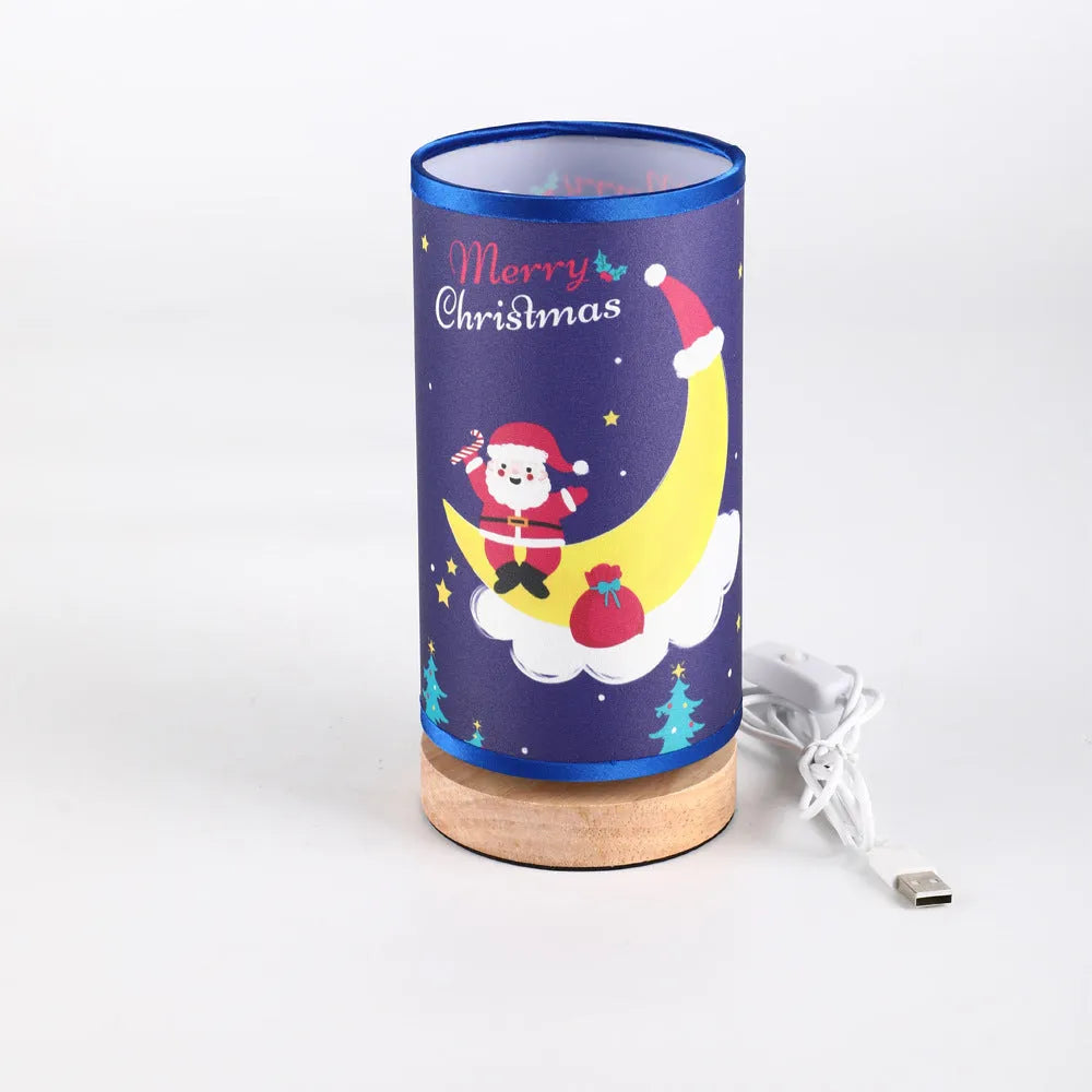 Moon Santa Claus themed LED night light with a bamboo base and a USB plug cable.