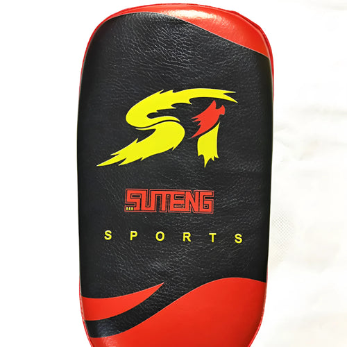 Black and red square hand-held martial arts kick pad with a double buckle strap on the back.