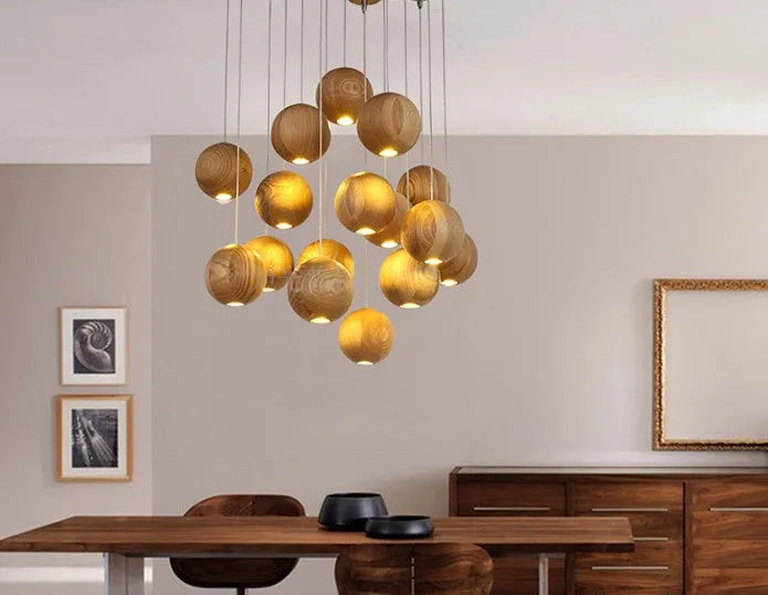 Nordic solid wood ball chandelier pendant light with wooden shade, shown in a living room setting.