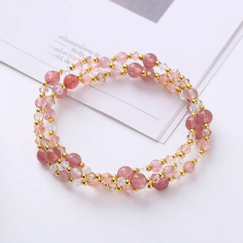 Women's adjustable three-ring crystal bracelet with tourmaline, strawberry quartz, and amethyst beads.