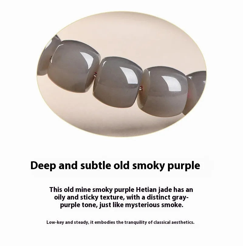 Straight cut smokey violet Hetian jade bead bracelet on a wrist, showing unisex casual style.