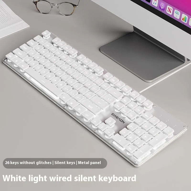 Wired computer keyboard with mute button and blue backlighting on a desk