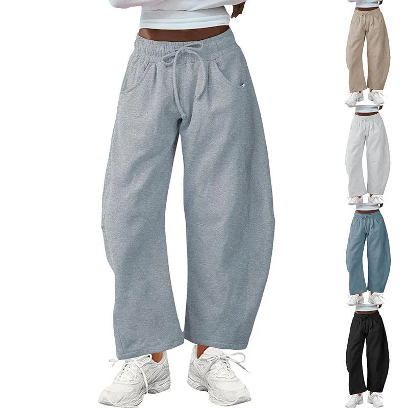 Loose cropped cotton sweatpants with elastic drawstring waist and side pockets in multiple colour options