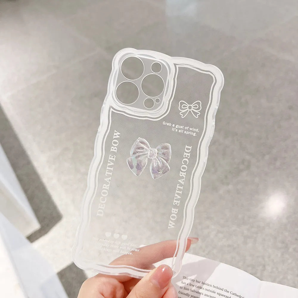 Transparent TPU iPhone case with three-dimensional ice-through bow design on white background