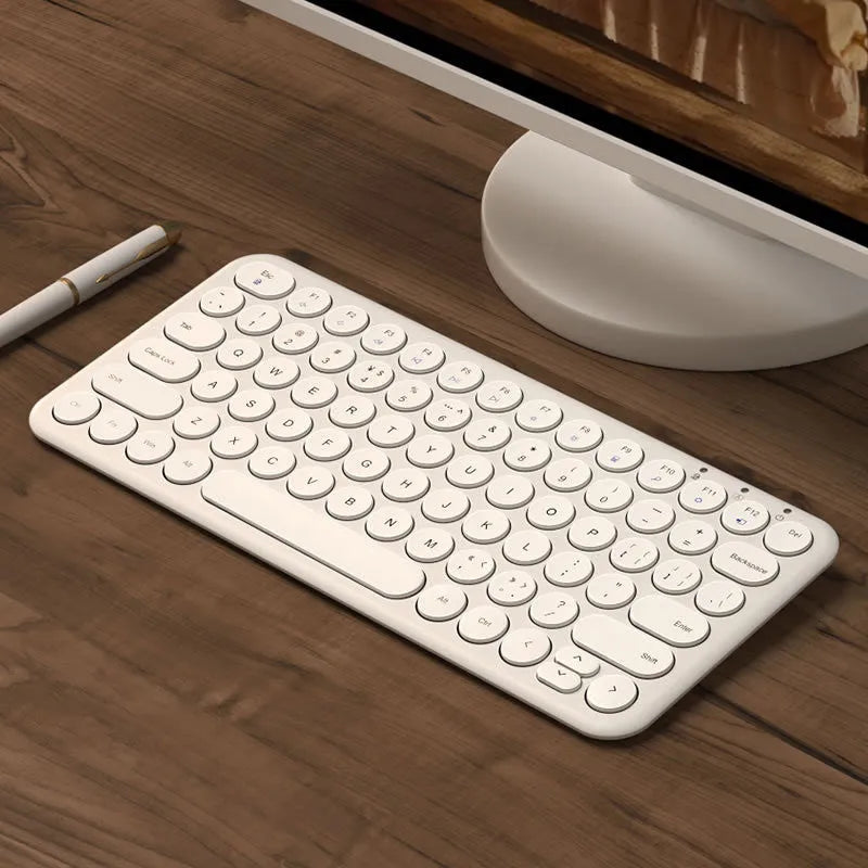 White ultra-thin wireless keyboard and mouse set with USB receiver and keyboard film on desk