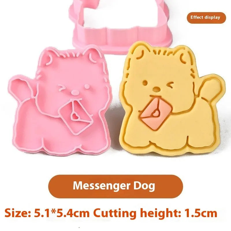 Three dimensional plastic biscuit mould showing puppy cartoon designs including birthday hats and swimming rings