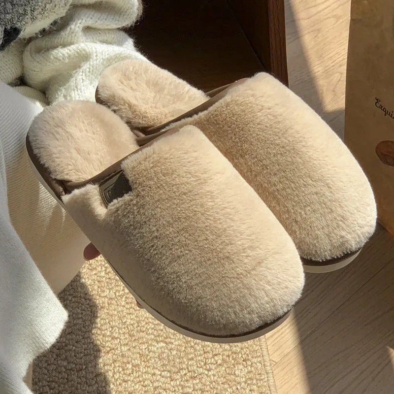 PVC non-slip winter slipper in a solid colour on a wooden floor.