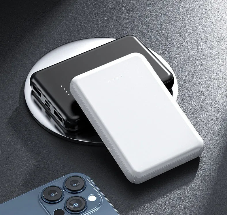 Black and white universal USB power bank for heated vests, showing compact size