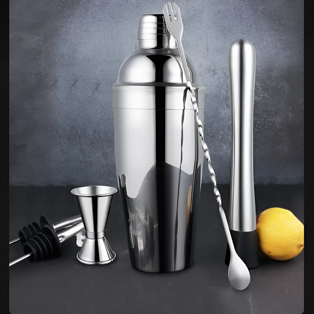 23-piece stainless steel and acrylic cocktail set with shakers and bar tools on a counter.