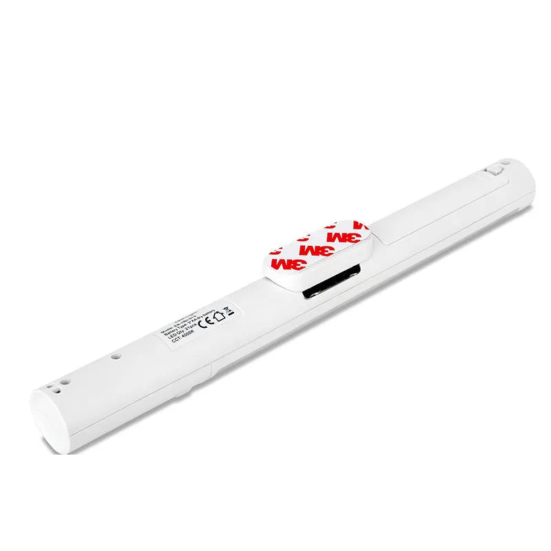 A slim 260mm long white LED strip light with a magnetic back for cabinet mounting.