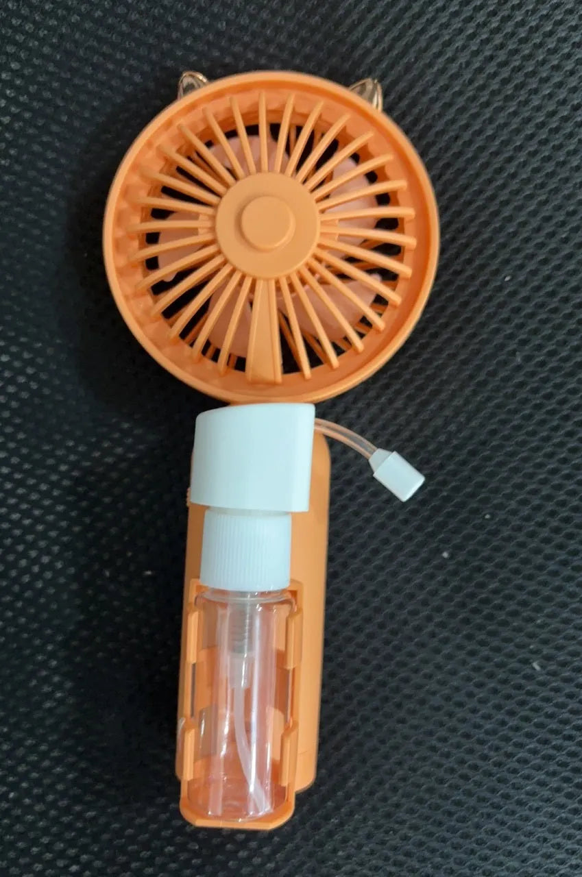 USB-powered personal handheld fan in apricot colour with plastic nozzle