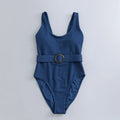 Women's navy blue solid colour one-piece swimsuit with triangle shape and chest pads on a mannequin.