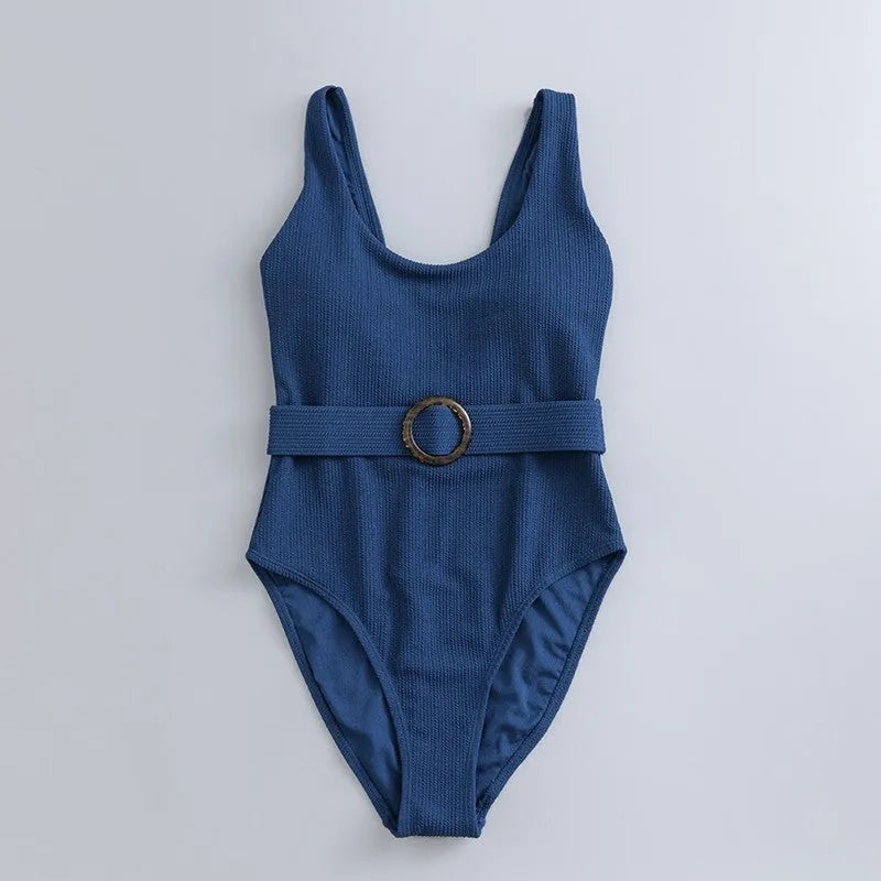 Women's navy blue solid colour one-piece swimsuit with triangle shape and chest pads on a mannequin.