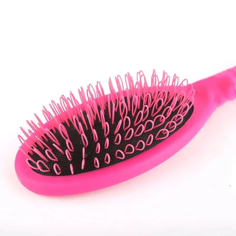 Black and pink plastic hairdressing comb with ring teeth for hair extension application