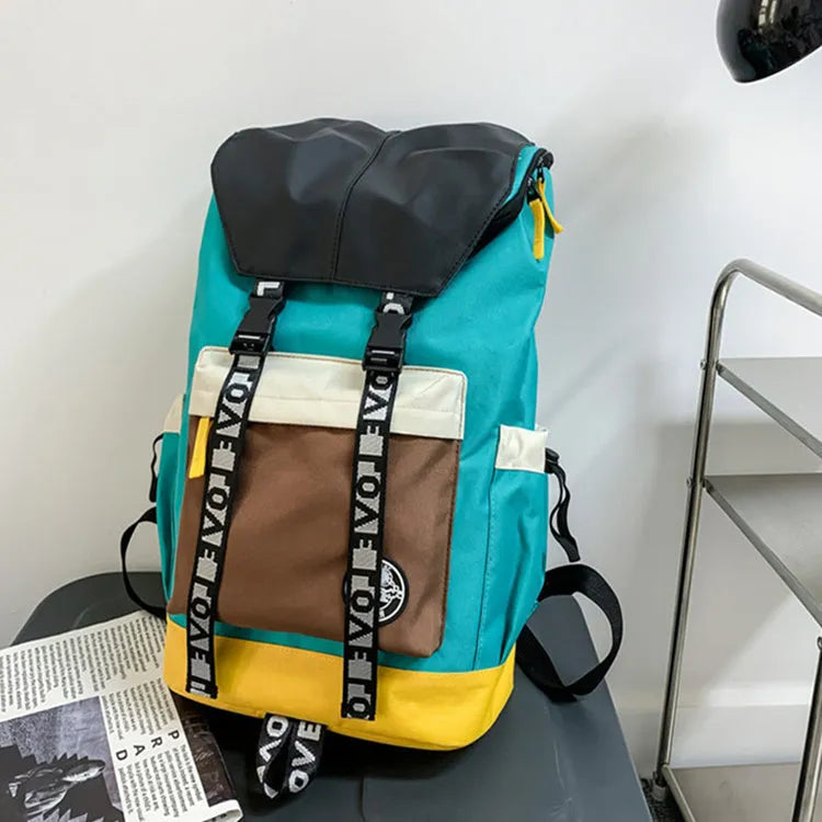 Oxford cloth backpack in black, green, or red with adjustable carrying straps.