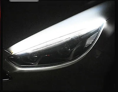 Flexible silicone car LED strip light showing daytime running light and flowing turn signal function in blue to yellow colour.