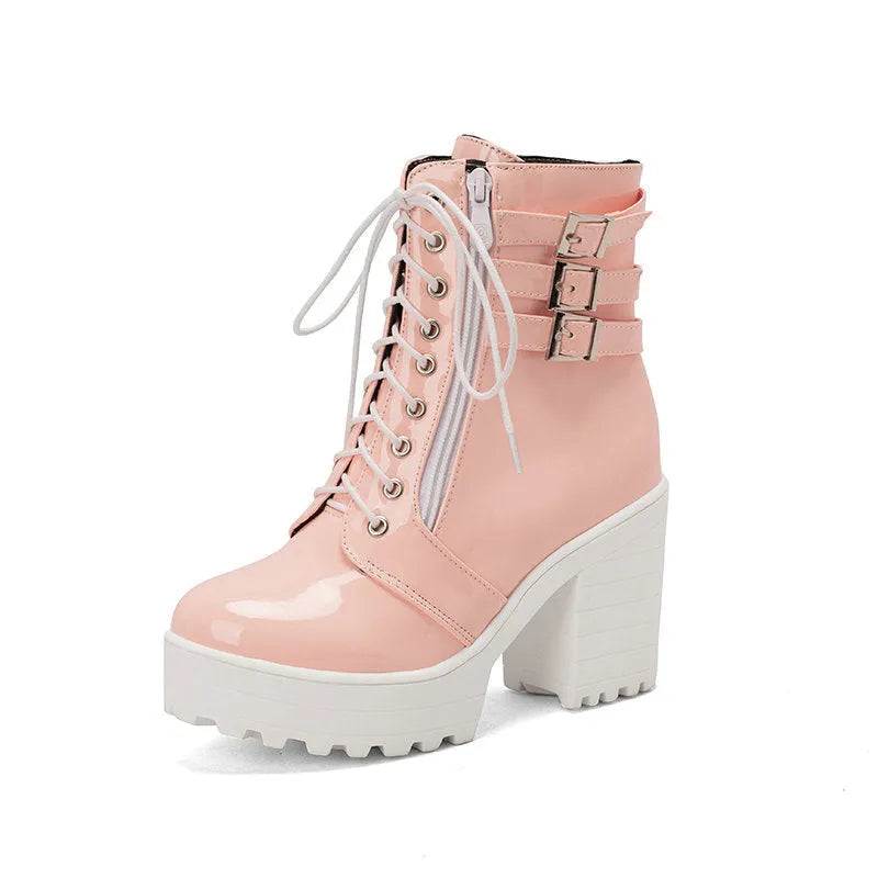 Women's black ankle boots with thick heel, round toe, and front lace-up on a waterproof platform sole.