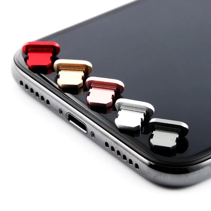 Aluminium alloy charging port dust plug for iPhone in various colours including gold, silver, blue, and rose gold.