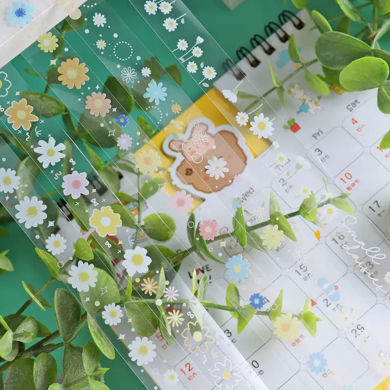 Transparent adhesive tape with midsummer daisy cartoon design on 5 rolls showing 1.5cm width