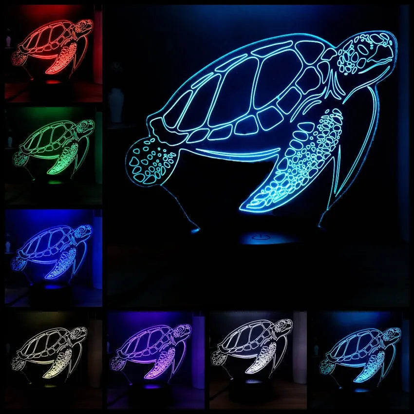 Clear acrylic 3D turtle-shaped LED night light showing multiple colour options on a dark surface.