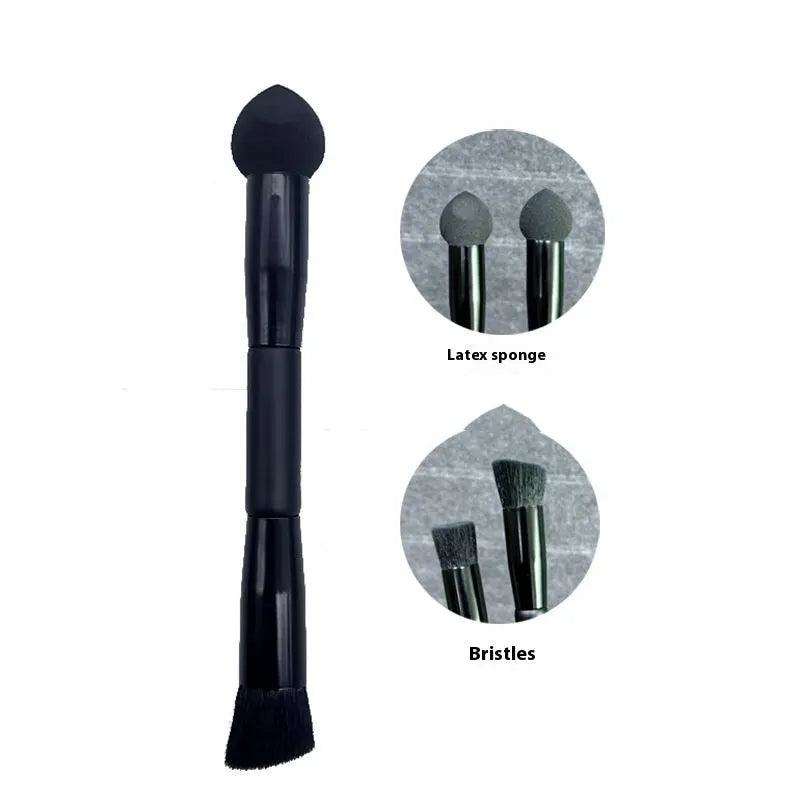 Black dual-ended concealer brush with a wooden handle and a pointed sponge applicator tip for under-eye makeup.