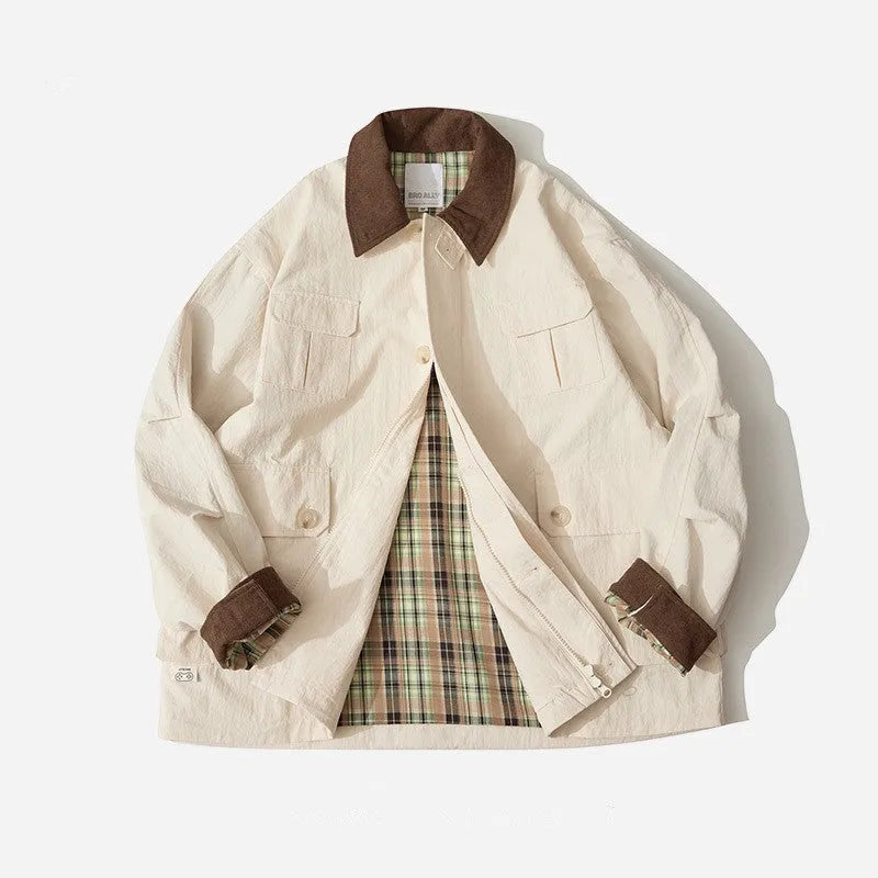 Green unisex casual jacket with contrast colour panels and side seam pockets on a model.