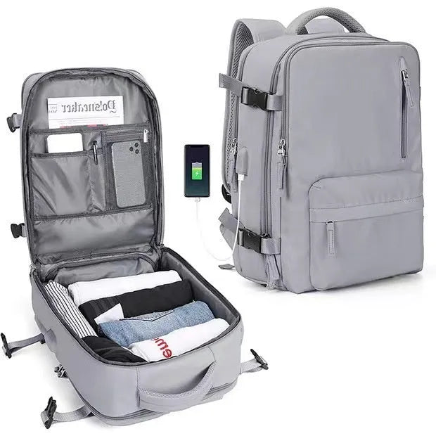 Large black waterproof nylon mummy backpack with zipped compartments.